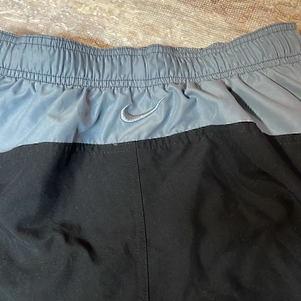Nike men’s black/gray swim trunks. Size S.